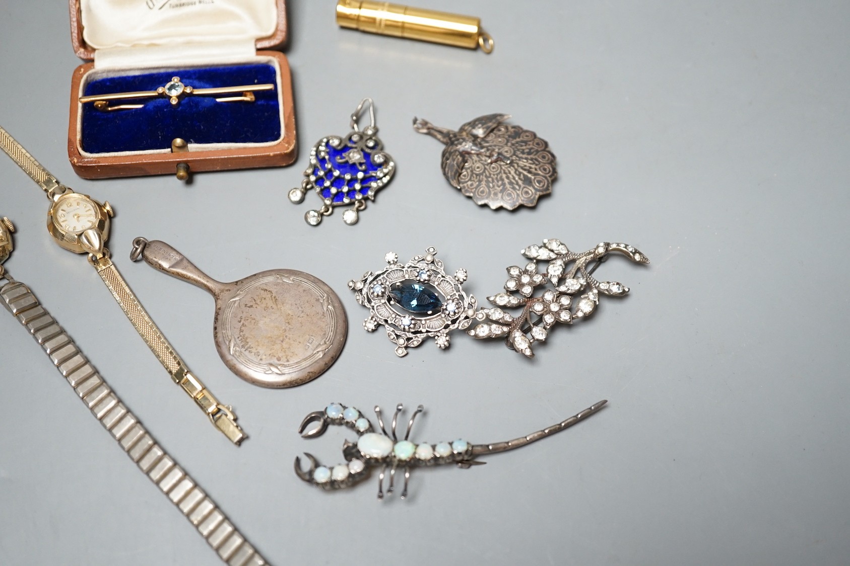 A cased Edwardian yellow metal, aquamarine and seed pearl set bar brooch, 55mm, sundry jewellery including costume, opal set scorpion brooch and enamel and paste set drop pendant and a wrist watch.